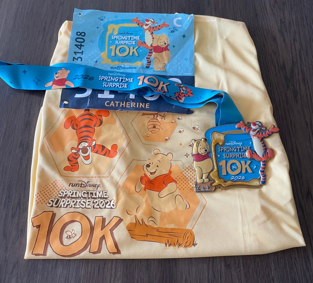 Picture of race t-shirt, bid, and medal